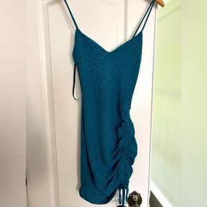 Sparkly teal dress from Windsor with tied ruched on one side!